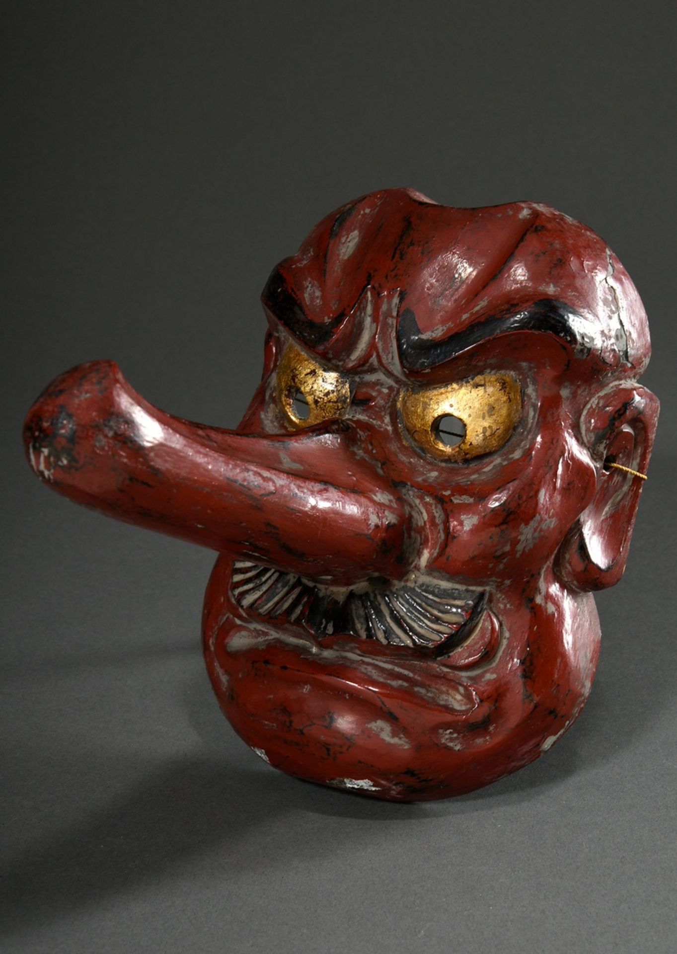 Kagura mask "Long-nosed Tengu", wood with red lacquer finish, Japan, 19th c., h. 20.5cm, partly dam