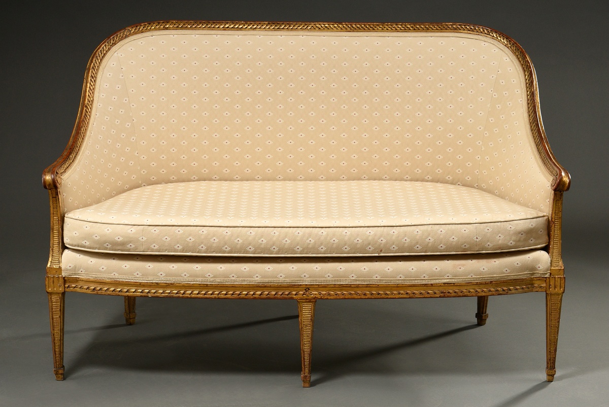 Small Louis XVI sofa with curved frame on 5 legs, carved band profiles and grooves in gilding over 