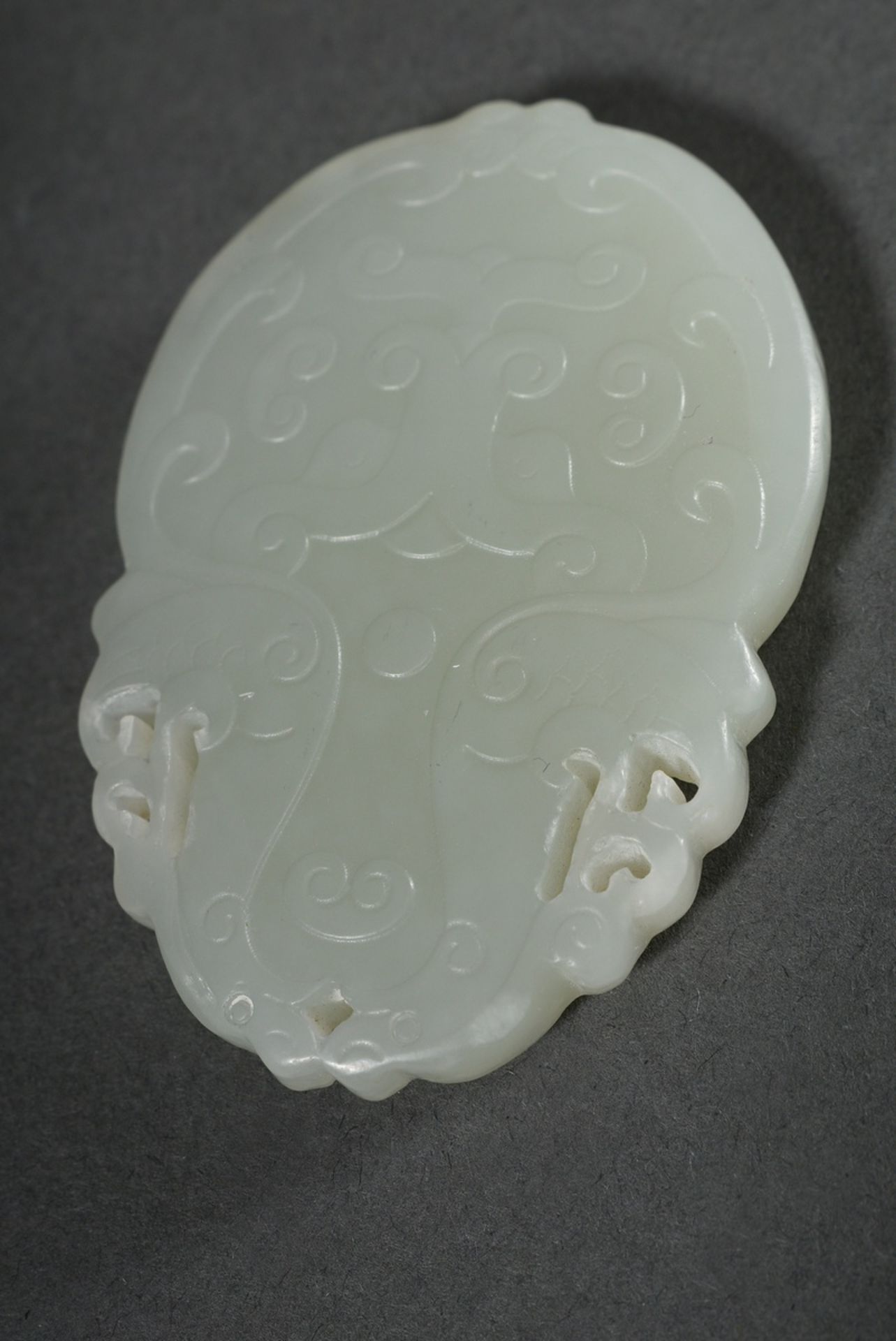 Pale celadon jade tablet pendant, finely cut taotie masks and mythical creatures in bas-relief on b - Image 2 of 3