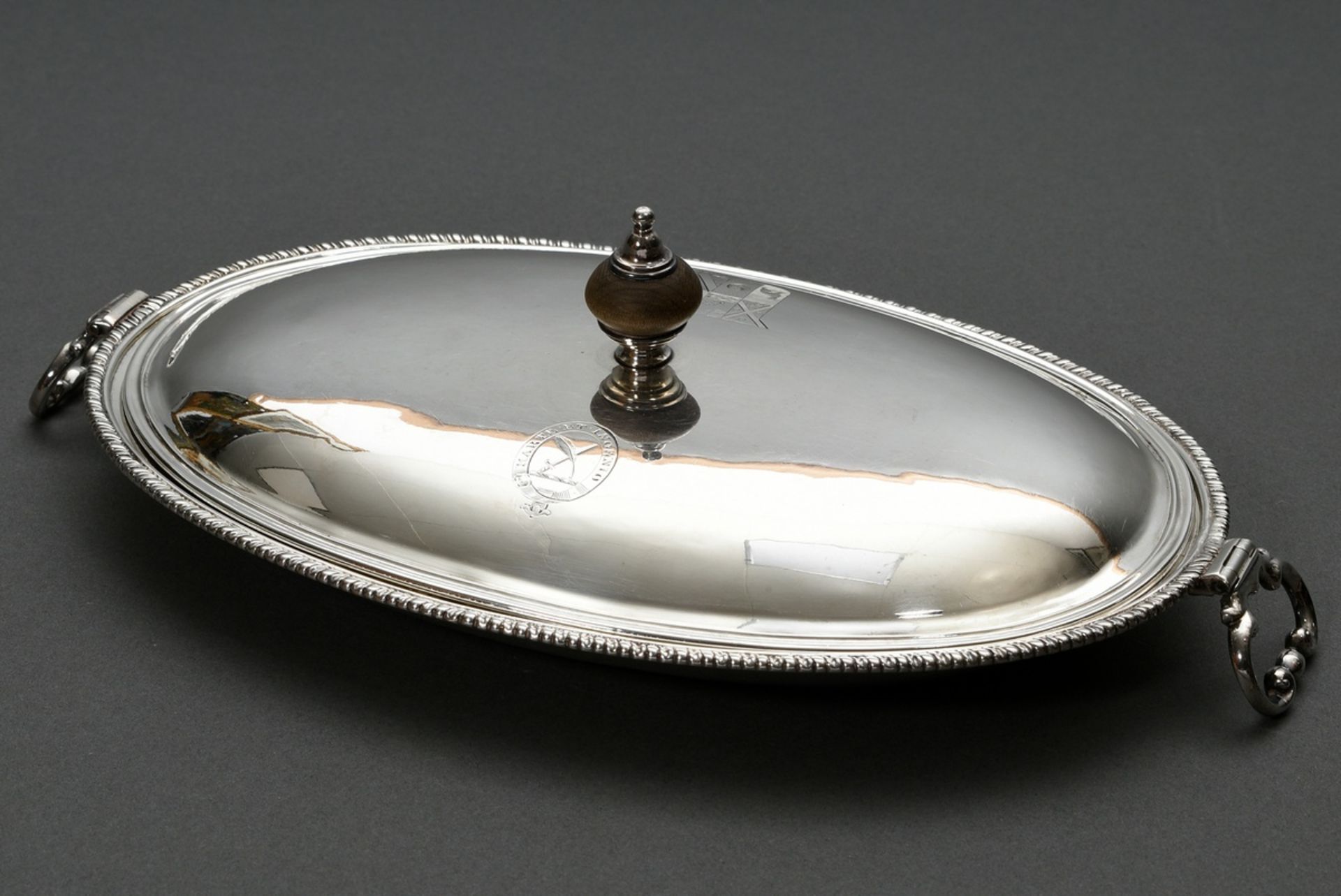 Elegant flat oval lidded bowl with movable handles, fluted rim and ebonized lid knob and engraved H