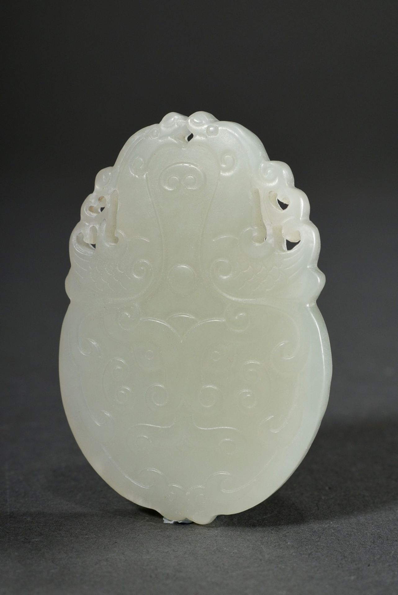 Pale celadon jade tablet pendant, finely cut taotie masks and mythical creatures in bas-relief on b - Image 3 of 3