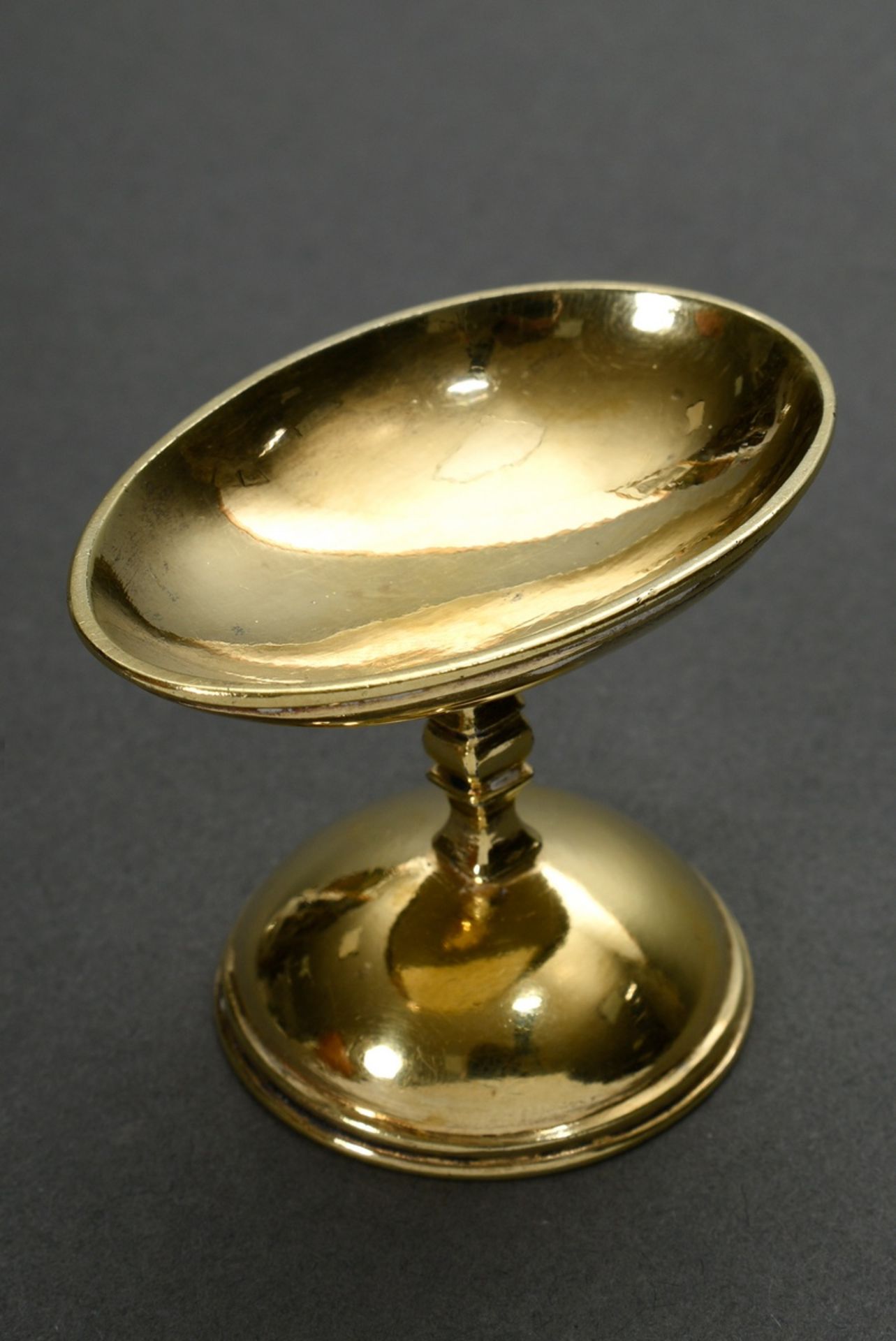 Antique egg cup made of ovoid foot part with angular baluster shaft and hemispherical vessel, proba