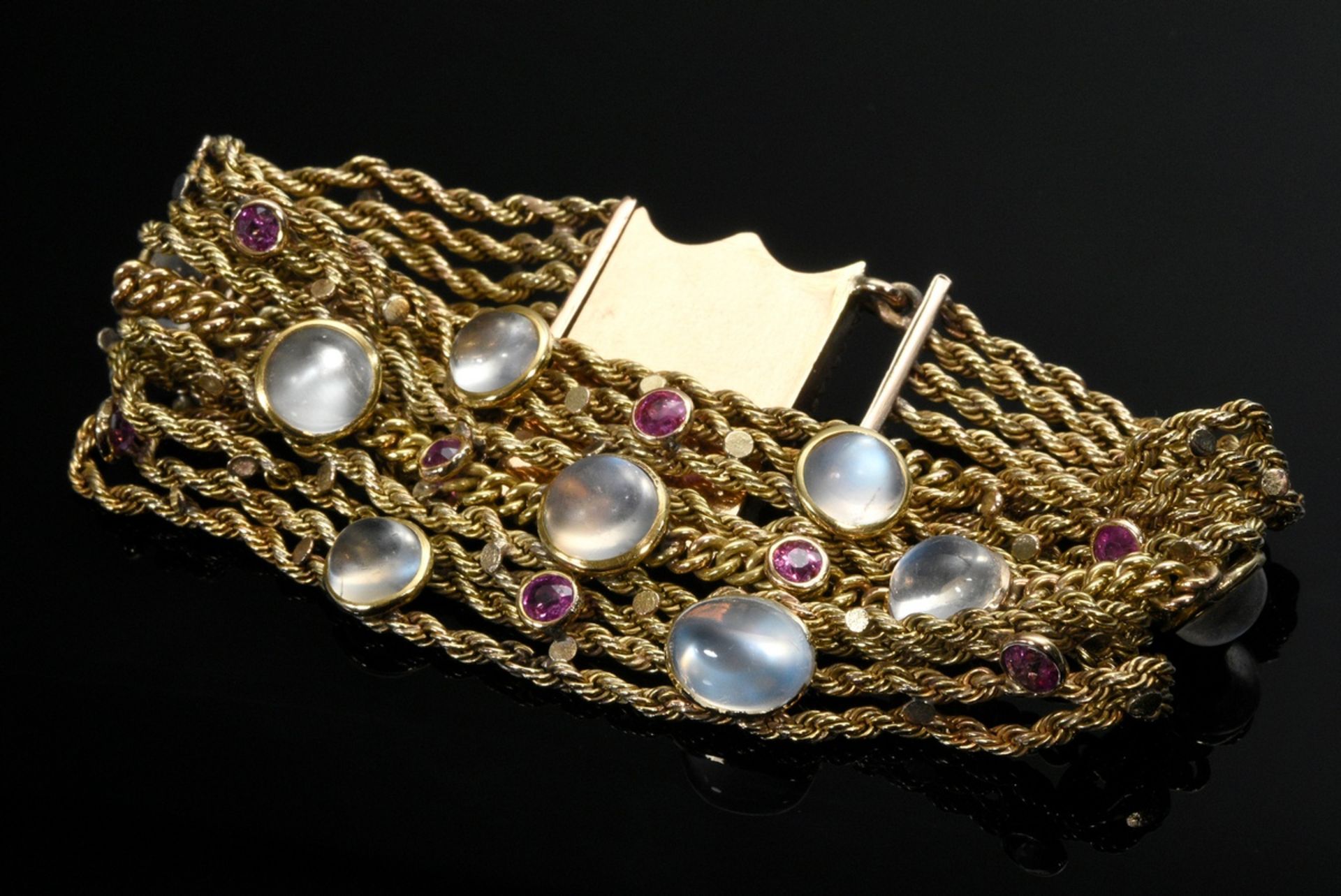 Multi-strand yellow gold 585 bracelet with moonstones and rubies and red gold 750 clasp, 36.9g, l. 