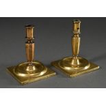 Baroque brass candlestick on square plinth on four small feet and baluster shaft, around 1700, h. 1