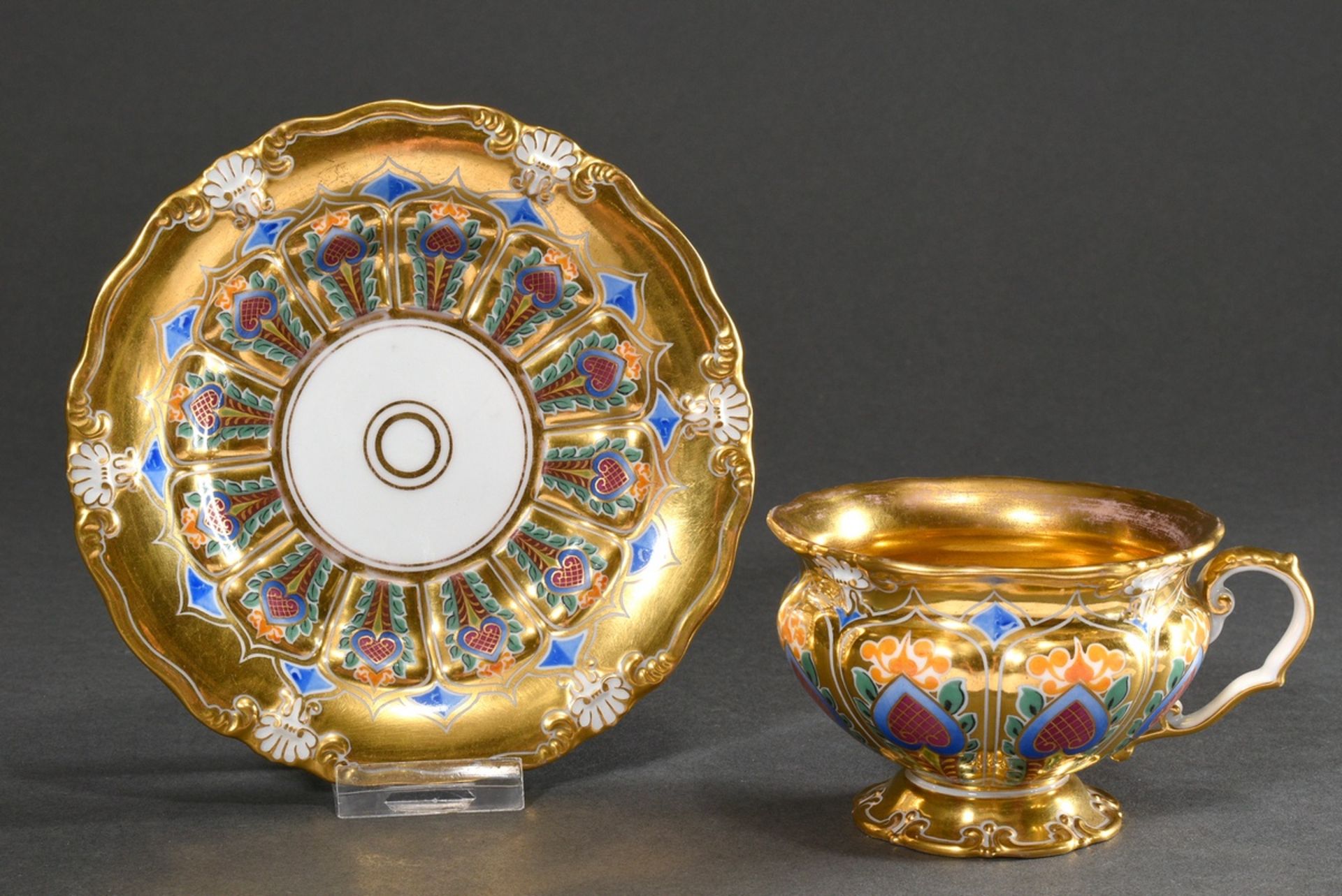 Biedermeier KPM cup with humped wall and strong coloured ornaments on gold ground in fine painting 