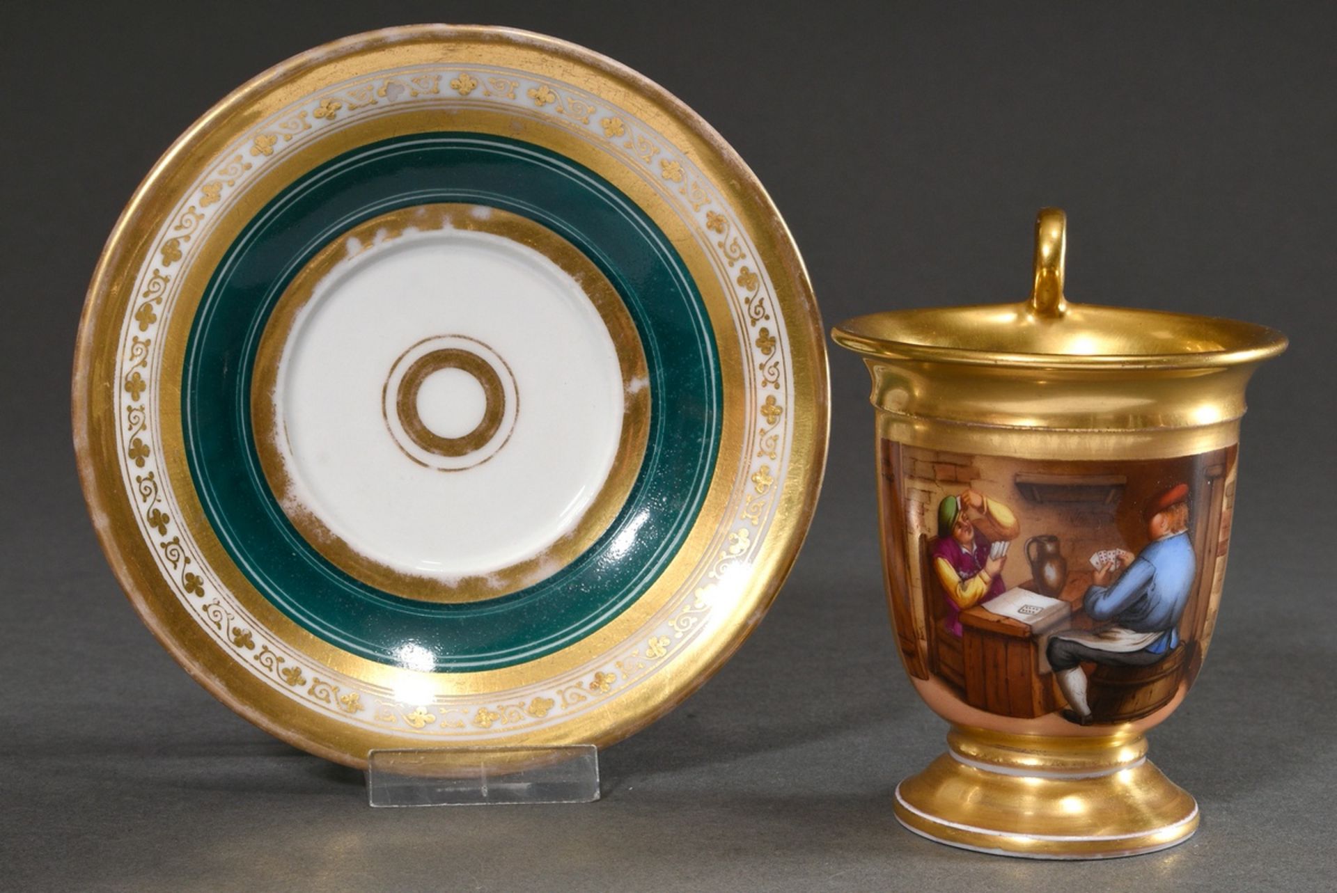 Biedermeier cup with painted cartouche "Card Player" on dark green background with floral and gold 