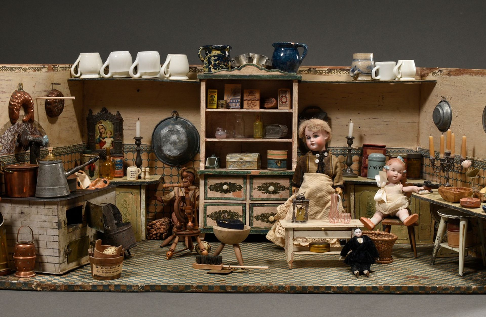 Wilhelminian period doll's kitchen with rich interior, metal cooker, earthenware and porcelain, pew