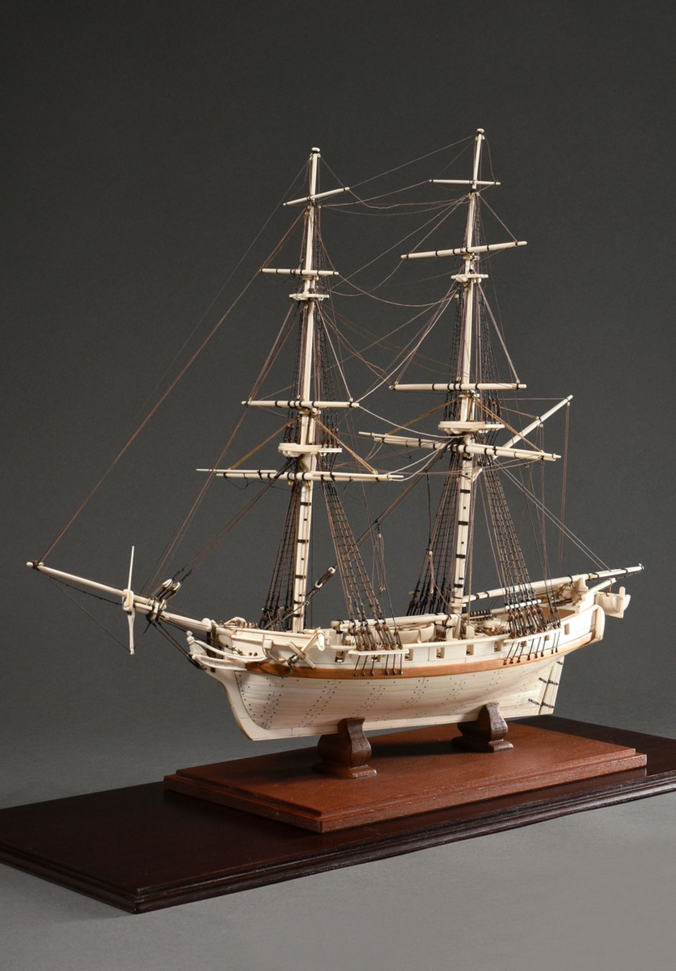 Scrimshaw model ship of the 18 gun brig "Irene" with filigree rigging on wooden base, detailed hand