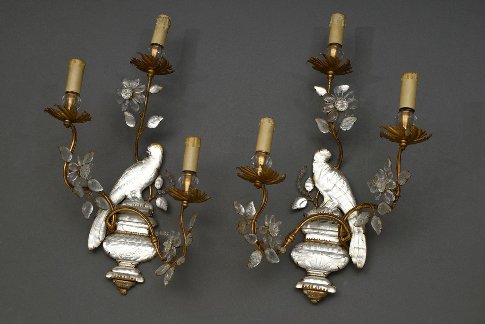 Pair of figural Maison Baguès appliqués in the form of seated parrots, each with three vegetal twis