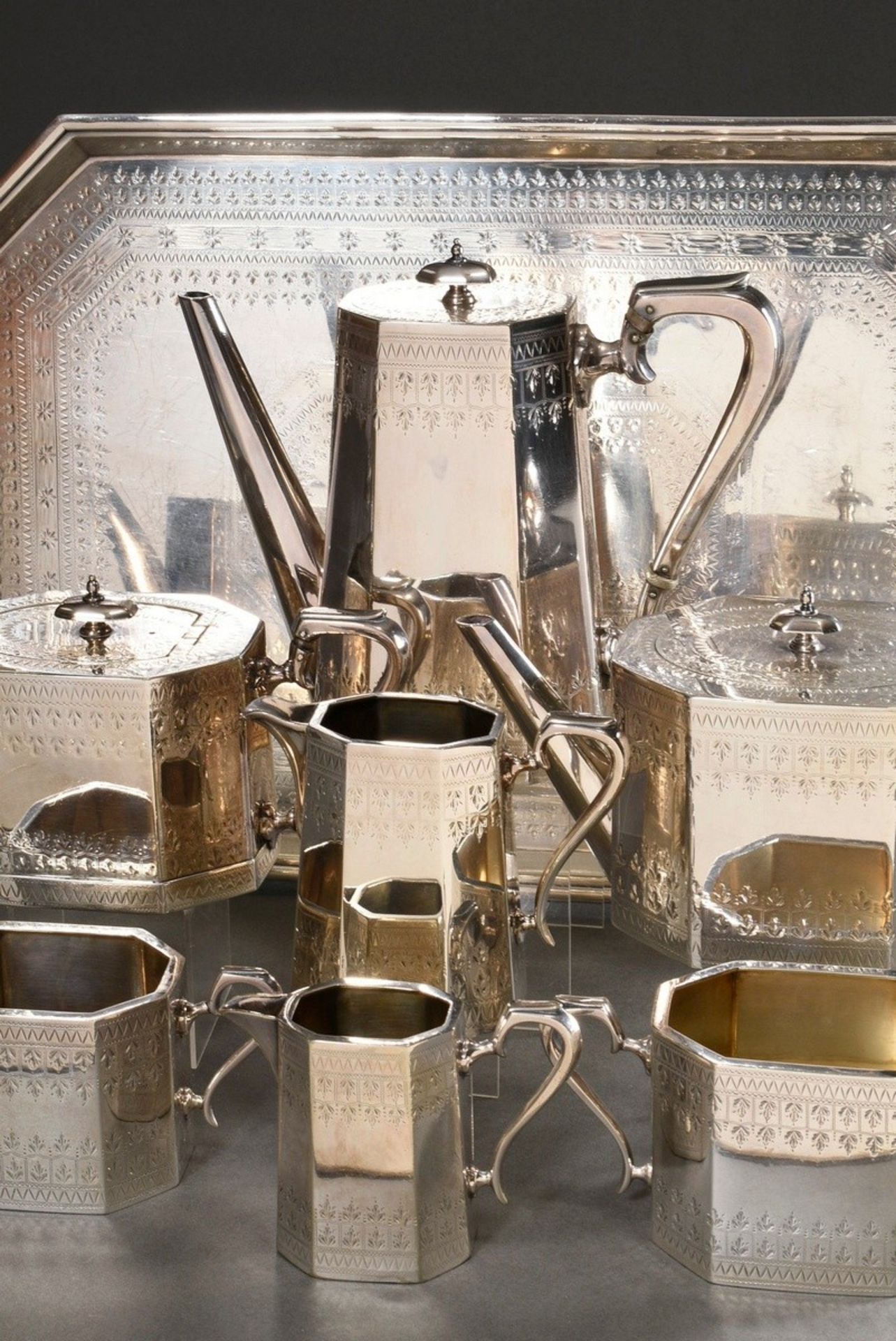 8 Piece silver plated coffee tea service with graphically abstracted leaf friezes on octagonal wall