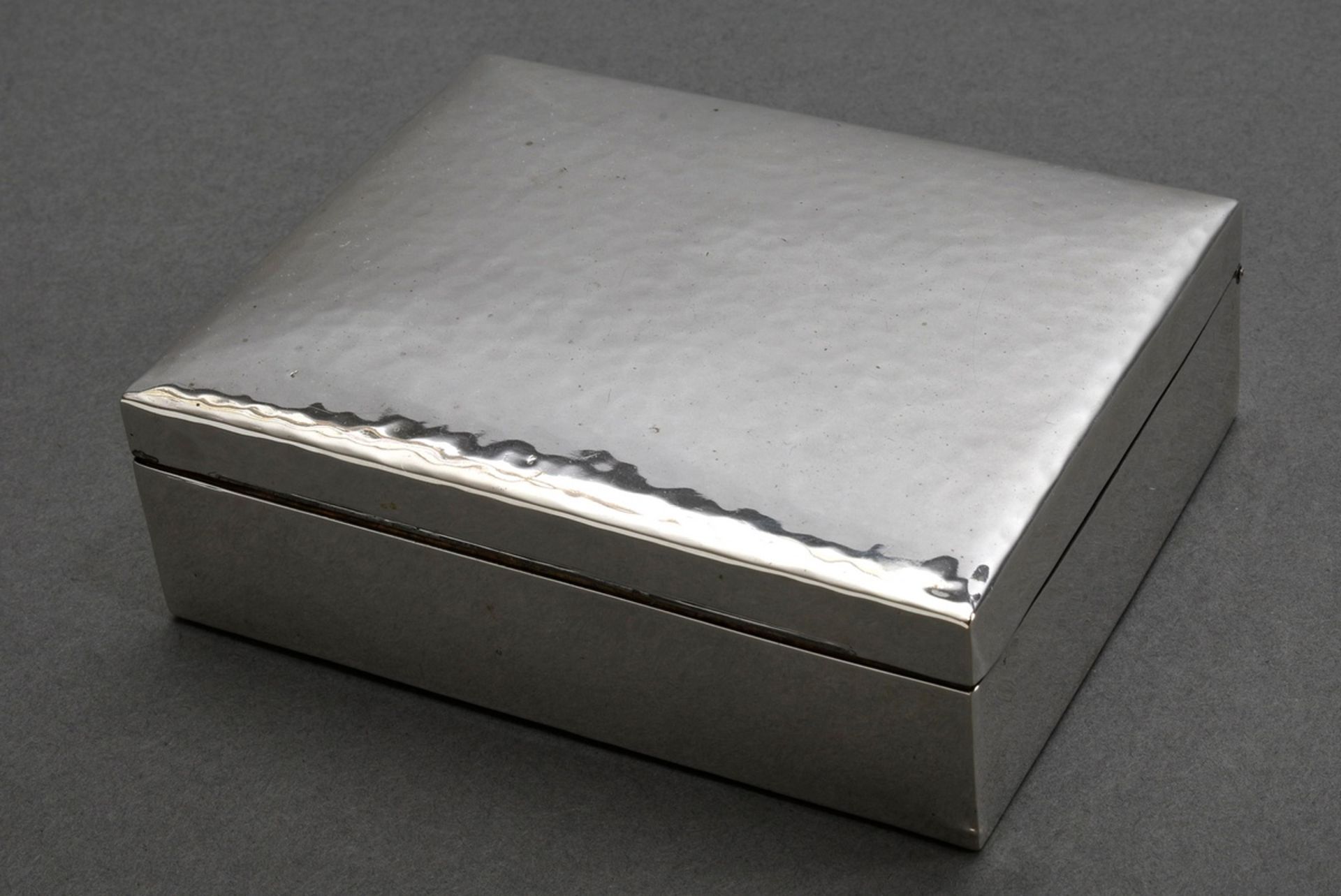 Martellated cigarette box with wooden interior, 20th c., silver 800, 3,5x11,5x9cm