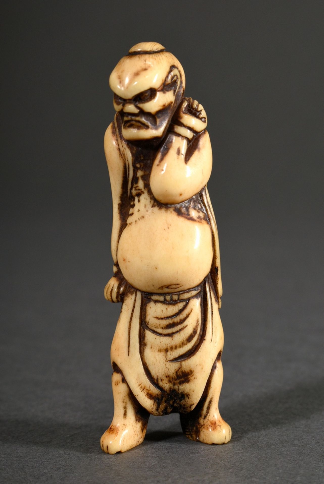 Staghorn netsuke "Grim looking temple guard Nio", shiny patina, h. 7,6cm, provenance: North German 