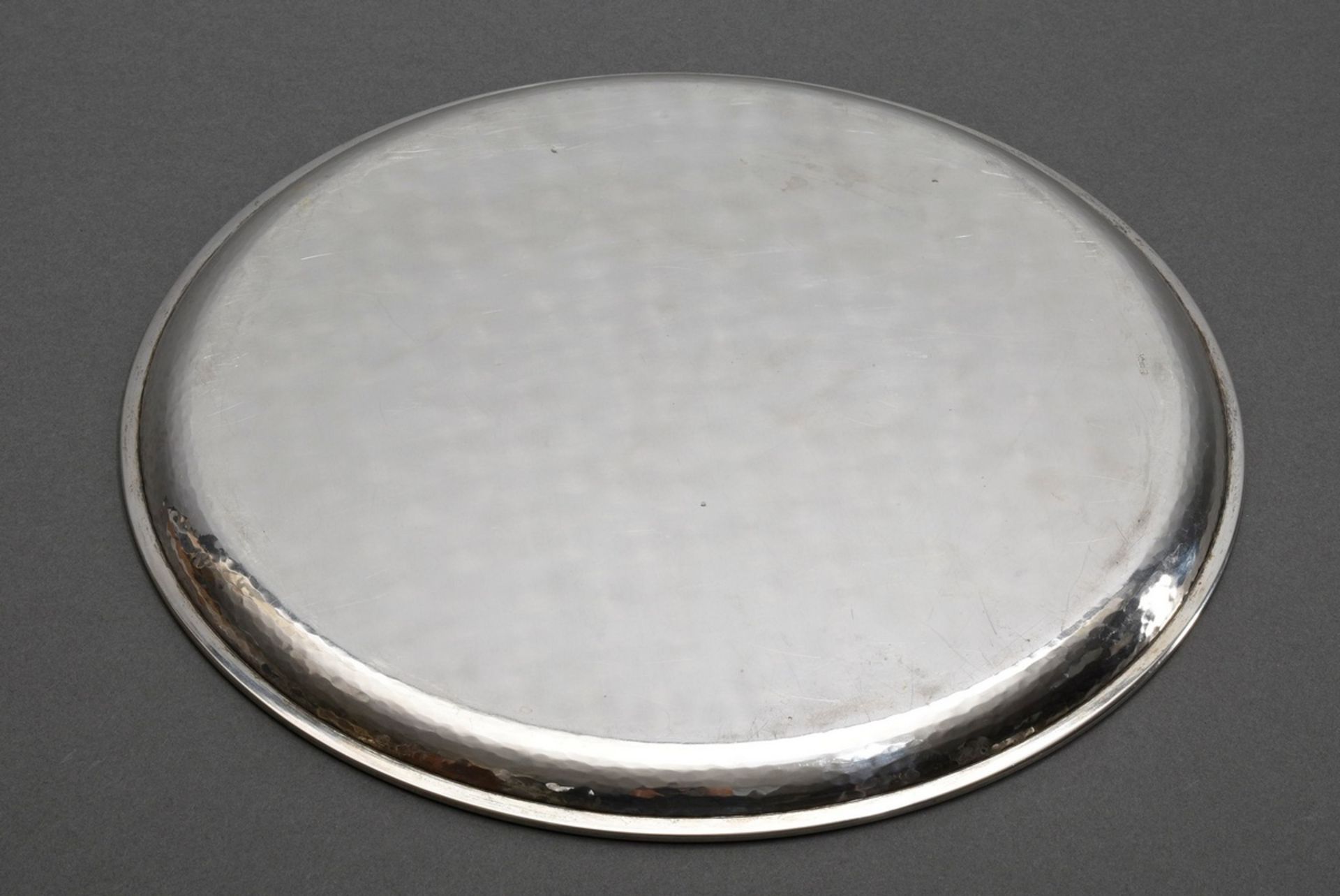 Martellated round tray in simple façon, German around 1930/1940, silver 830, 536g, Ø 30cm, slight s - Image 2 of 3