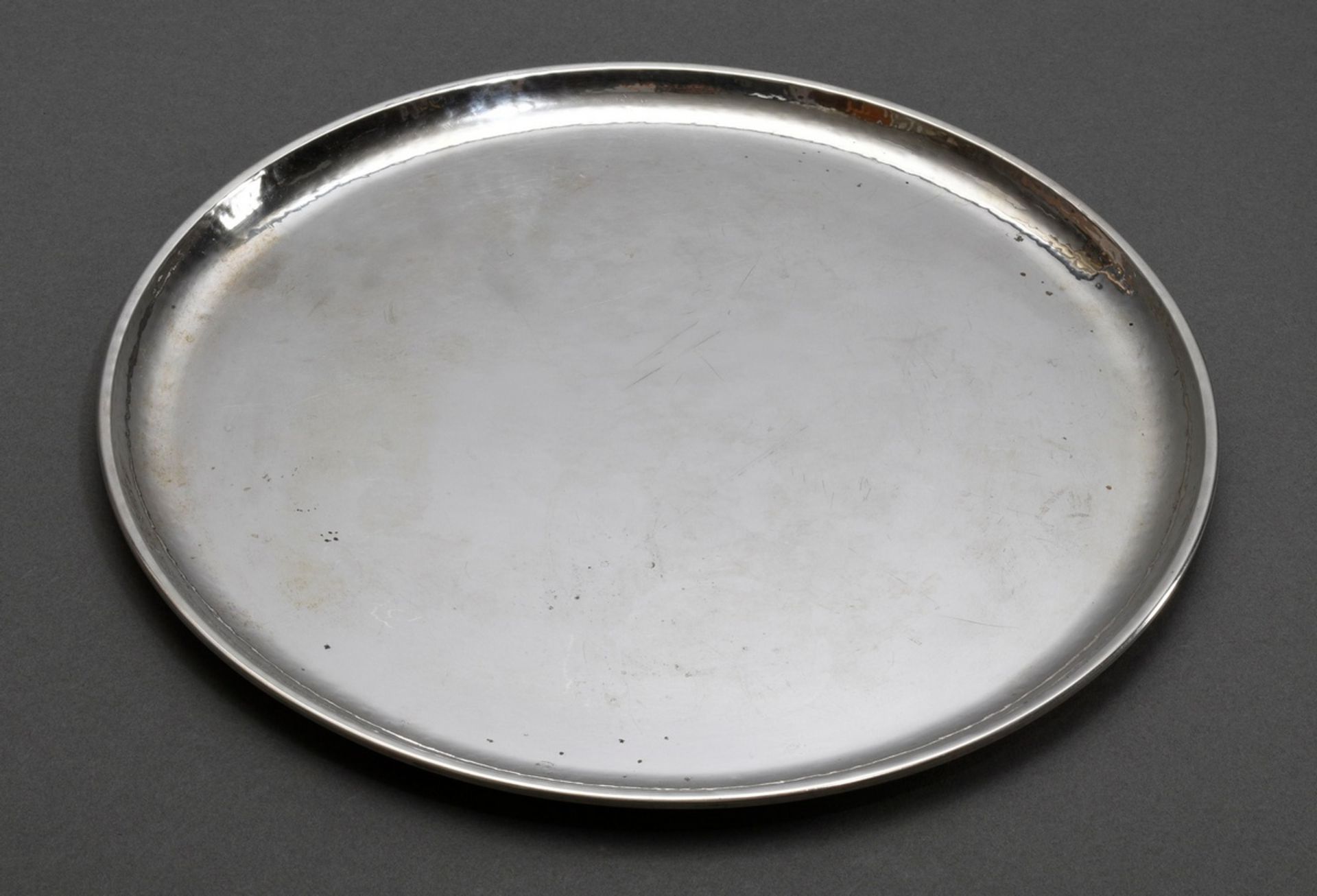 Martellated round tray in simple façon, German around 1930/1940, silver 830, 536g, Ø 30cm, slight s