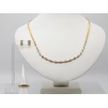 3 tlg. Schmuckset: Collier, Ring und Ohrstecker mit Brillantenbesatz, zusammen ca. 5,18 ct, 21. Jh.