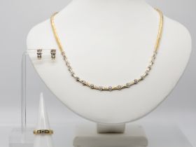 3 tlg. Schmuckset: Collier, Ring und Ohrstecker mit Brillantenbesatz, zusammen ca. 5,18 ct, 21. Jh.