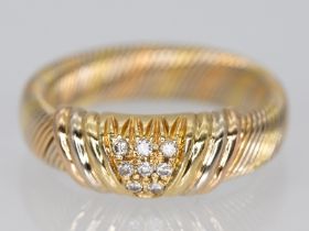 "Cartier" Ring mit 8 kleinen Brillanten, zusammen ca. 0,1 ct, Paris, 90-er Jahre.