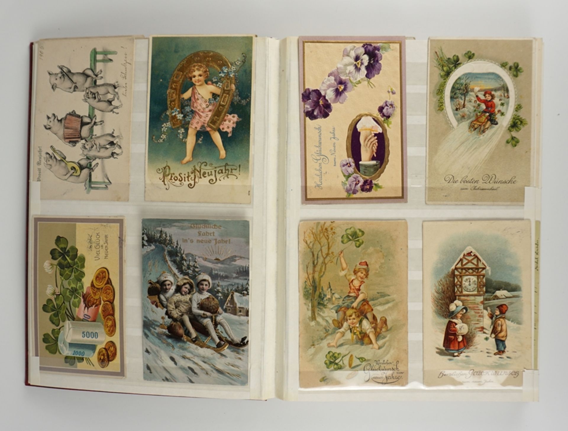 128 Gruß- und Glückwunschkarten, um 1900-ca.1930, im Steckalbum