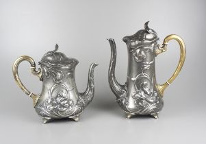 Pair of art nouveau teapots with iris decor, Württembergische Metallwarenfabrik, Geislingen