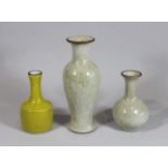 Drei Vasen, China, Porzellan, zwei Vasen beige grundiert mit Krakelee, eine Vase gelb glasiert mit