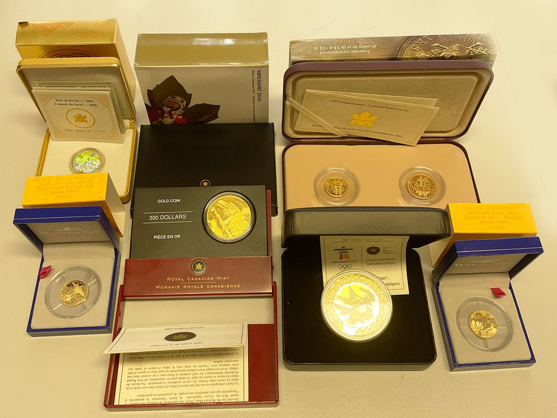 Konvolut Gold: 1 x 2007 Olympic Games Canada 300 Dollars 58,33% Gold, 41,67% Silber, 60 gr.; 1 x