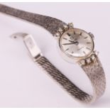 Omega, Damenarmbanduhr, mit Brillanten, 750er WG, L. 18 cm, 32 g