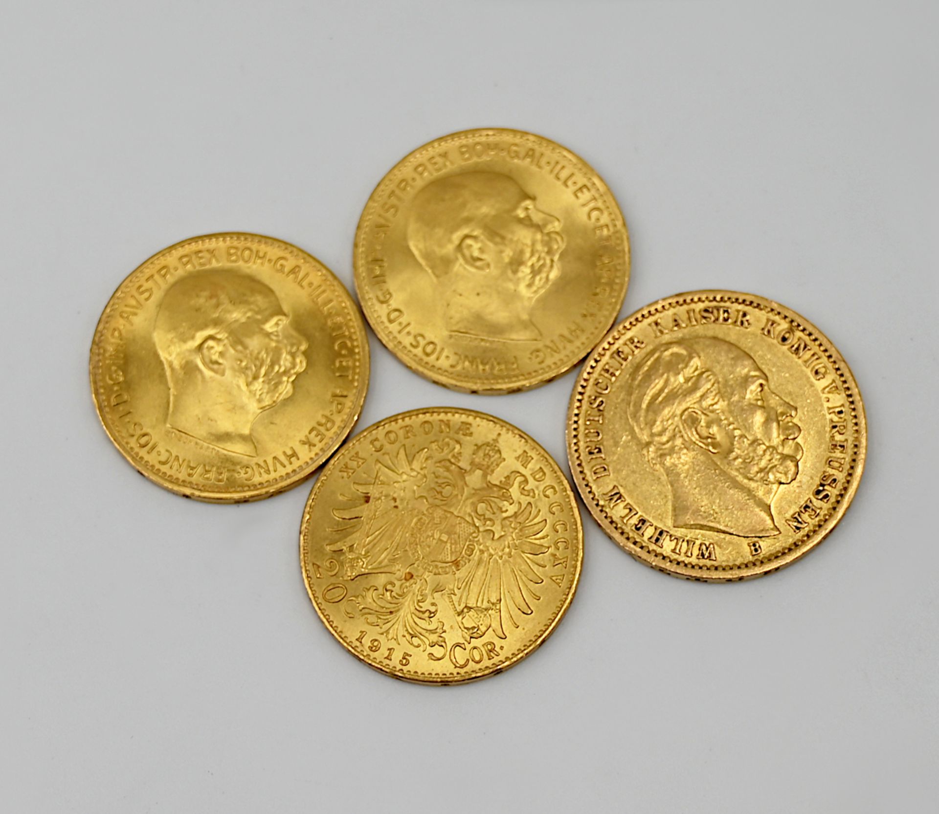 4 Goldmünzen (3x Österreich je 20 Cor, 1x Deutsches Reich 20 Mark gestempelt 1872),