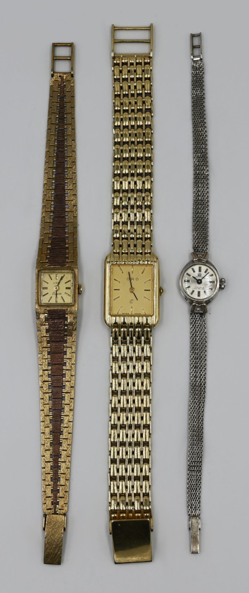 2 Armbanduhren GG/WG je 14ct., sowie 1 Armbanduhr GG/RG 8ct., je Asp./Gsp.