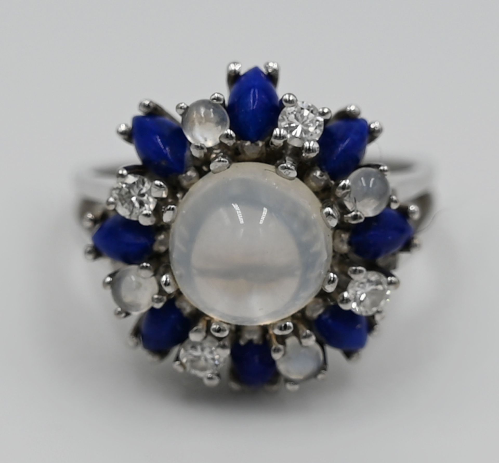 1 Damenring WG 18ct., mit Brill. je ca. 0,05ct., Mondstein, wohl Lapislazuli, Ringgr. ca. 53, wohl G