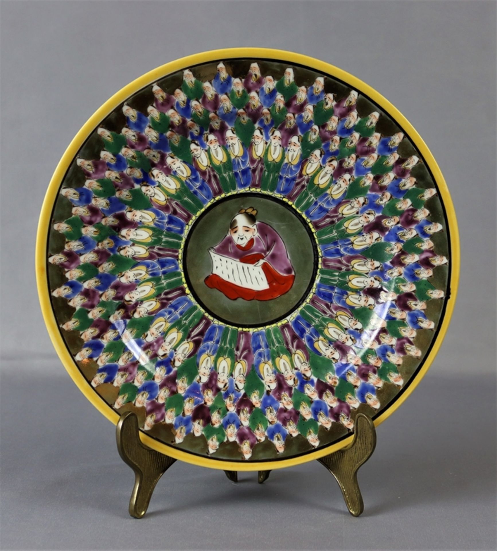 Decorative plate, depicting the 1000 faces Japan circa 1920
