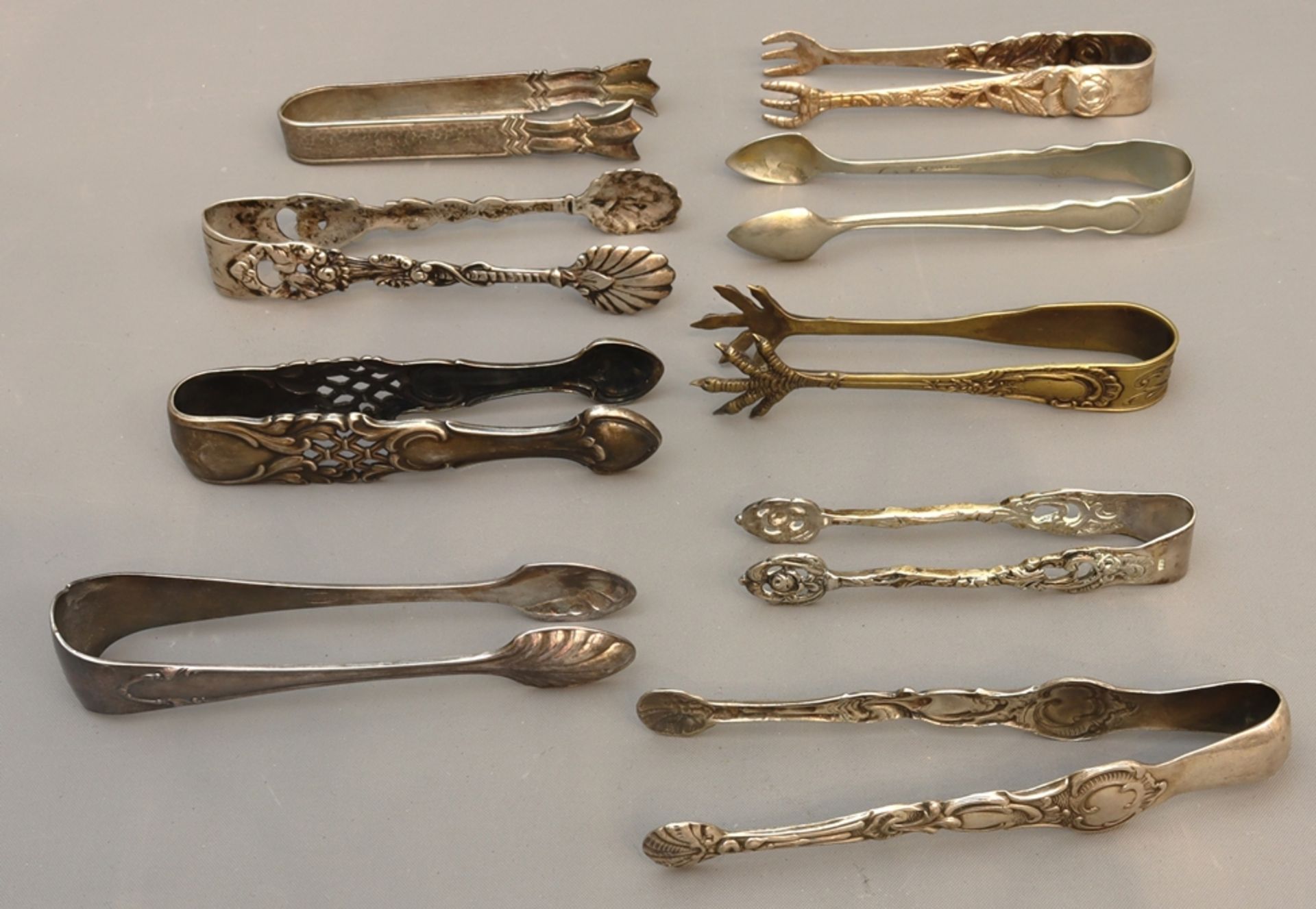 Silver sugar tongs of various types, early to mid 20th c., German