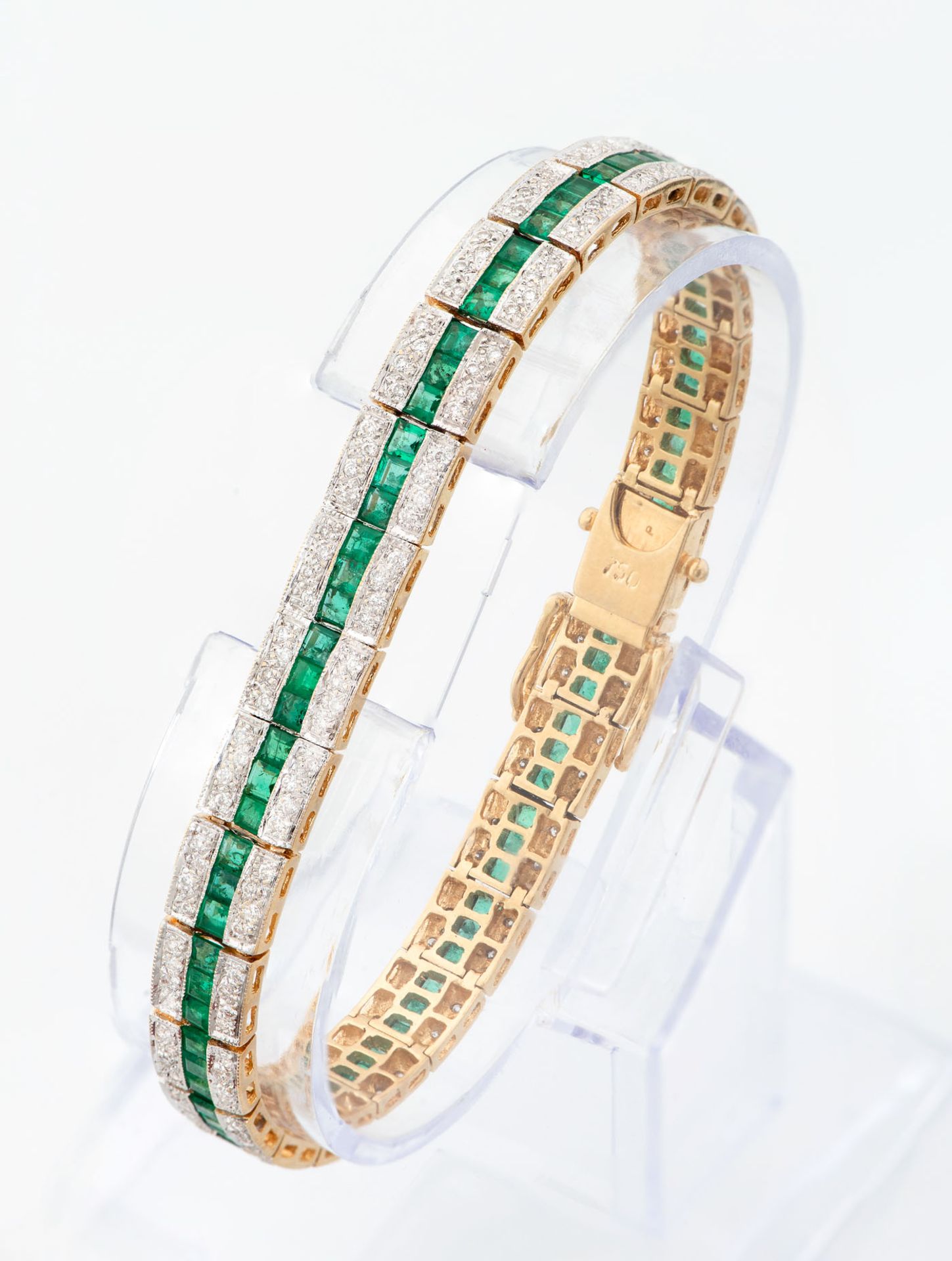 A Fine Art Deco 18K Gold Diamond and Emerald Tennis Bracelet