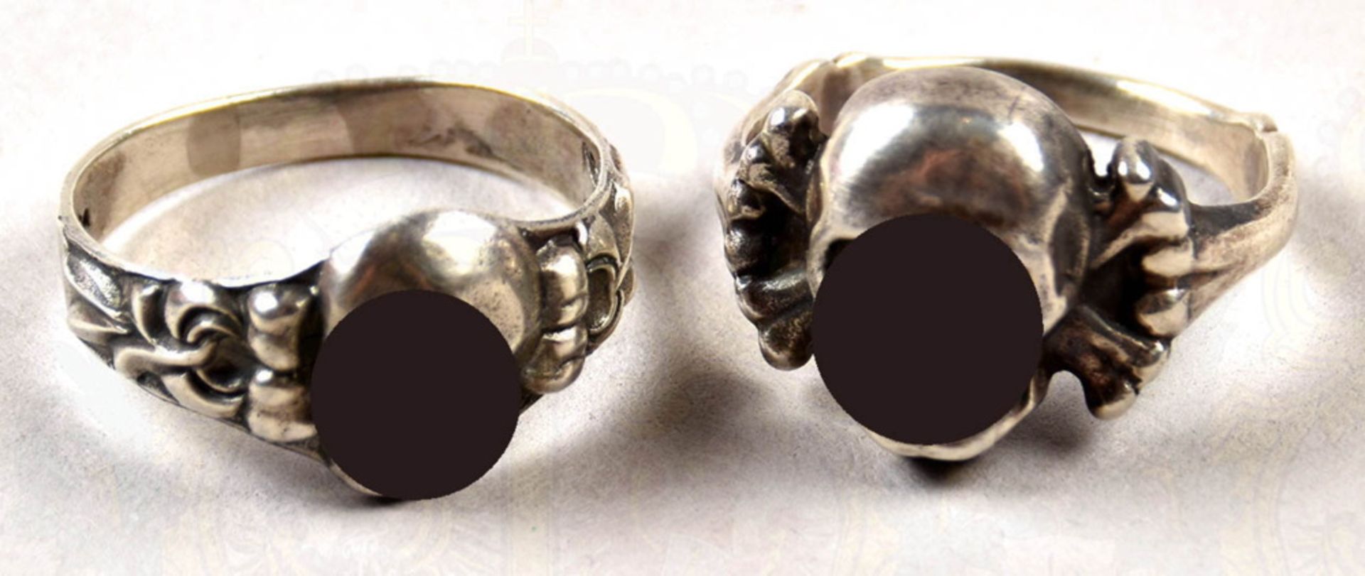 2 silver made death head finger rings