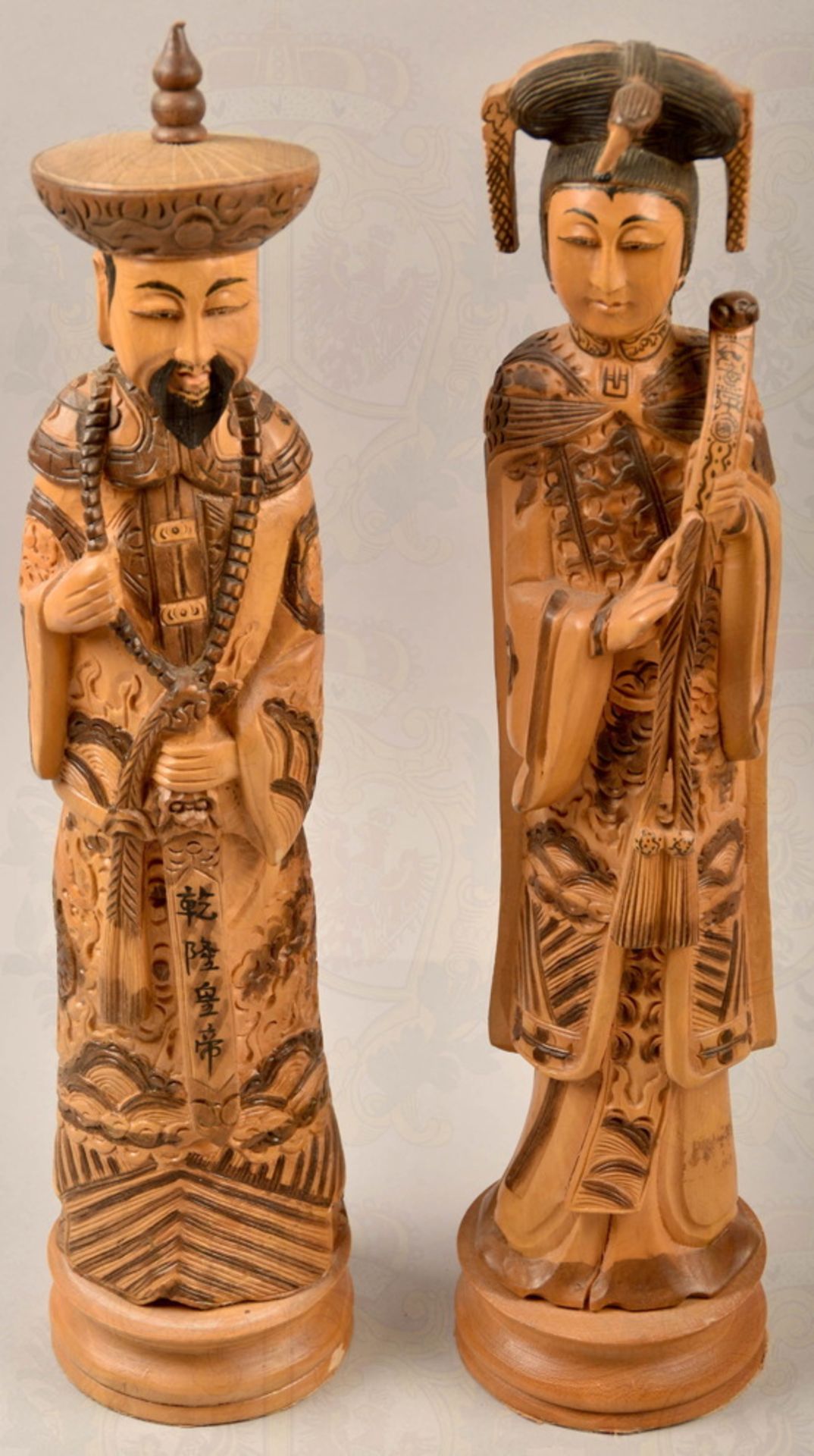 Pair of wooden figures with traditional Asian clothing