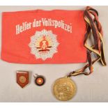 Collection of GDR National People's Police badges and insignias