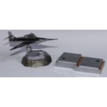 A mid-20th century chrome table lighter, as a fighter jet, marble base, 24cm long; an Art Deco style