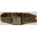 A lady's 9ct gold Longines watch, canted rectangular face, Roman numerals, integral 9ct gold