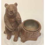 A Black Forest novelty table vesta, carved as a bear, early 20th century