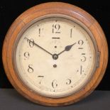 An early 20th century circular oak wall clock, Arabic numerals, single winding hole, 27cm diam