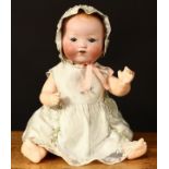 An Armand & Marseille (Germany) bisque head and composition bodied Dream baby doll, weighted