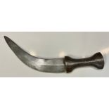 An Islamic dagger, steel grip and curved blade, chased in the Islamic taste, 26cm long