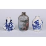 A Chinese inside painted glass snuff bottle, decorated with figures in a monumental landscape, 7cm