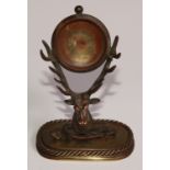 An early 20th century brass novelty combination pocket watch stand and pen rack, as a stag's head
