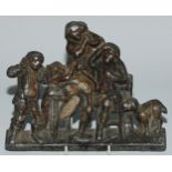 A 19th century lead plaque, cast with a genre scene, 21cm wide