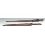 Tribal Art - a West African sword, 44cm blade, the copper and iron hilt with leather grip, 64cm long