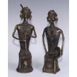 A pair of Indian Dhokra figures, cast as Hindu musicians, 31cm and 28.5cm high, West Bengal, first