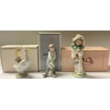 A Lladro figure, boy with panda toy, First Discoveries, 14cm, number 101.06974, boxed; a Nao figure,