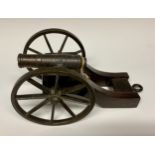 A bronze library model signalling cannon, 13cm barrel with live touch-hole, the oak carriage with