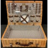 A wicker picnic hamper, fully fitted four four, brown leather handle and straps, 61cm wide