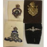 A Churchill Victory badge; an enamel Royal Artillery badge; an RAF pin; a British Legion badge (4)